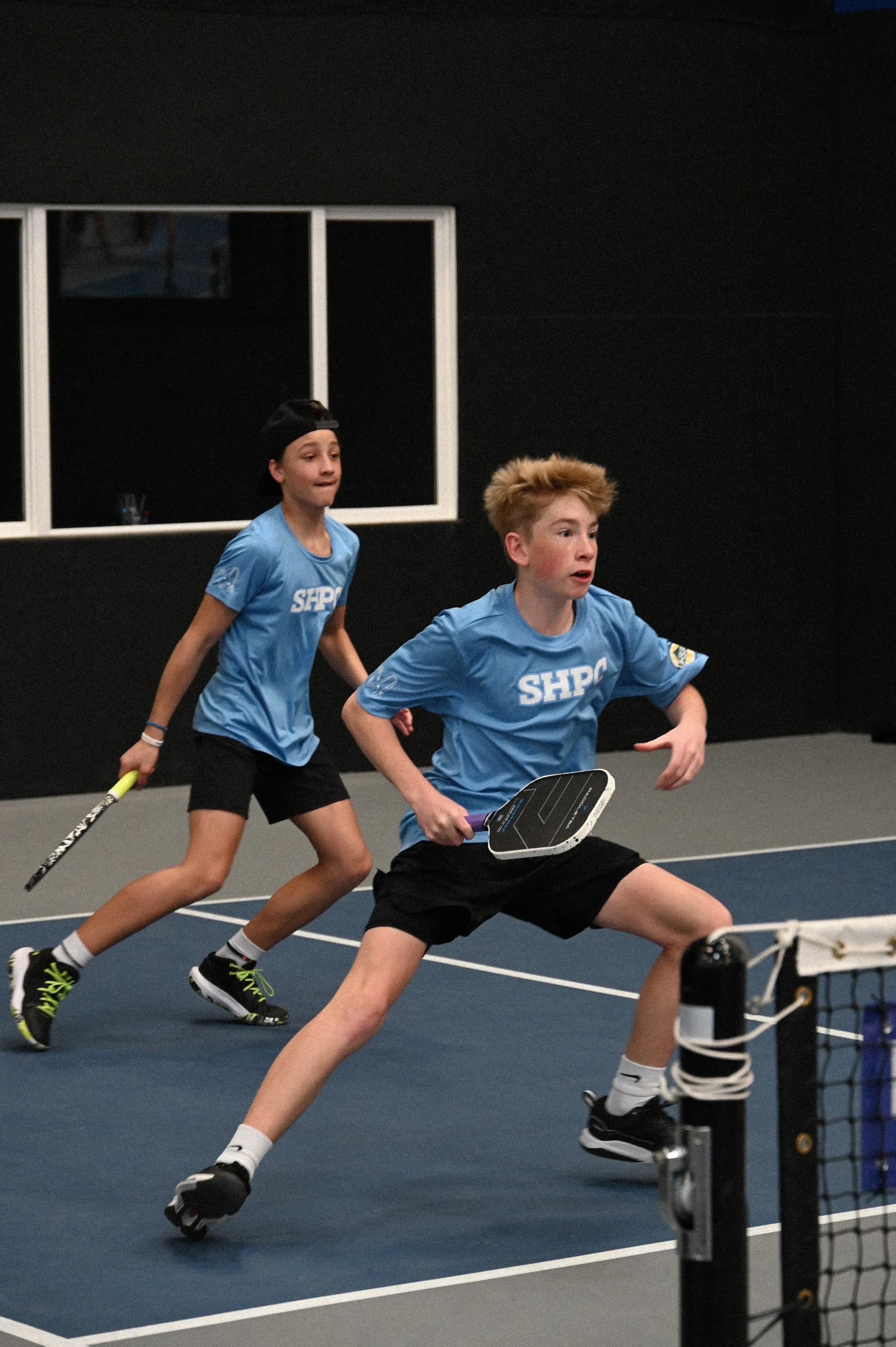 Boys playing pickleball